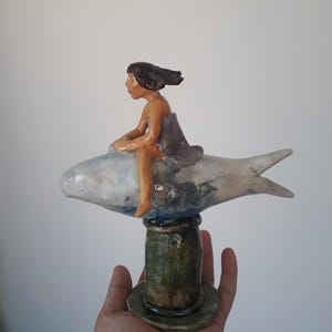 Girl Riding a Dream Fish – Handcrafted Ceramic Sculpture | Surreal Figurine Art | Ocean Fantasy Decor