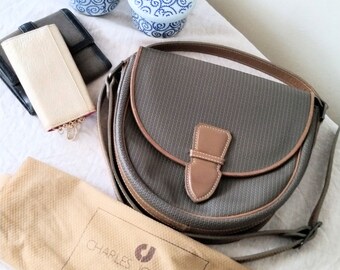 CHARLES JOURDAN Actif. Tan and olive vinyl and leather scallop shape crossbody bag. Vintage. Excellent condition.