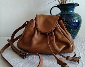 RENOMA. Small drawstring leather crossbody bag. Made in France