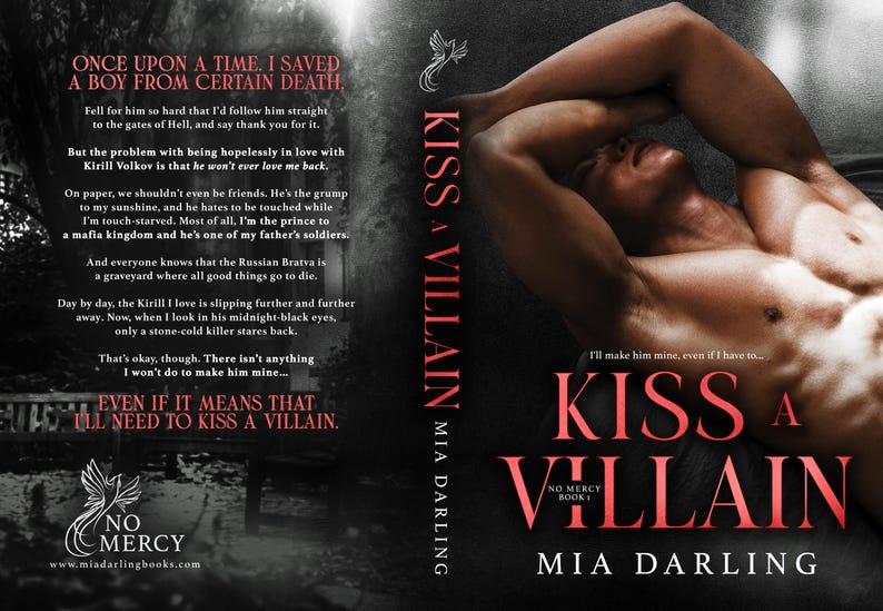 May include: Book cover for "Kiss a Villain" by Mia Darling. The cover features a shirtless man with dark skin and short black hair lying on his back with his arms crossed over his chest. The title "Kiss a Villain" is in large red letters with the words "No Mercy Book 1" in smaller white letters below. The author's name, "Mia Darling", is in white letters below the title.