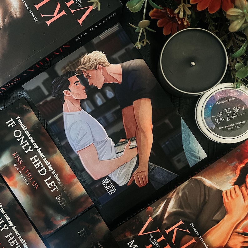 May include: A black and white bookmark with an illustration of two men. The bookmark features the text "If only he'd let me." and "Kiss a Villain".