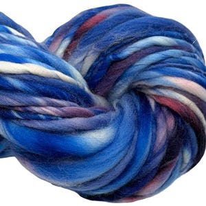 May include: A thick, hand-spun yarn skein featuring a variegated color palette of deep royal blue, light sky blue, soft white, and muted purple tones. The fibers are twisted into a bulky, textured strand with a soft, fuzzy appearance throughout.