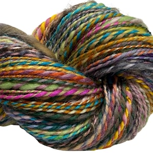May include: A skein of hand-spun yarn featuring a multi-colored palette of teal, lime green, bright pink, mustard yellow, orange, and deep purple. The yarn has a thick, textured appearance with varying ply thicknesses and a soft, fuzzy fiber finish.