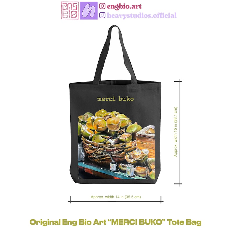 May include: Black tote bag with a vibrant illustration of a basket filled with green and yellow fruit, labeled "merci buko." The bag is approximately 15 inches (38.1 cm) high and 14 inches (35.5 cm) wide. The text "Original Eng Bio Art" is at the bottom.