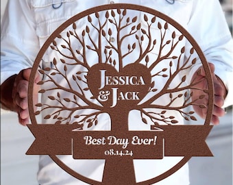 May include: A brown wooden tree of life with a heart in the center that says "Jessica & Jack" and a banner below that says "Best Day Ever! 08.14.24".