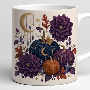 May include: A cream-colored ceramic mug featuring a decorative print of three pumpkins in dark blue, purple, and orange. The design includes large purple dahlia flowers, golden crescent moons, stars, hanging crystal pendants, and autumn leaves.