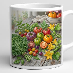 May include: White ceramic mug featuring a vibrant illustration of fresh tomatoes, kale, and squash blossoms on a rustic wooden table. The tomatoes vary in color from red to purple and orange. A bowl of tomatoes is in the background.
