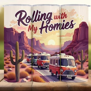 May include: Three stainless steel travel tumblers with a desert scene. The design includes a road with vintage vans, cacti, and the text "Rolling with My Homies". The tumblers are suitable for hot or cold drinks.