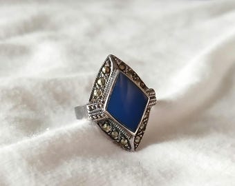 vintage sterling silver ring with marcasite stones and a blue topaz gem