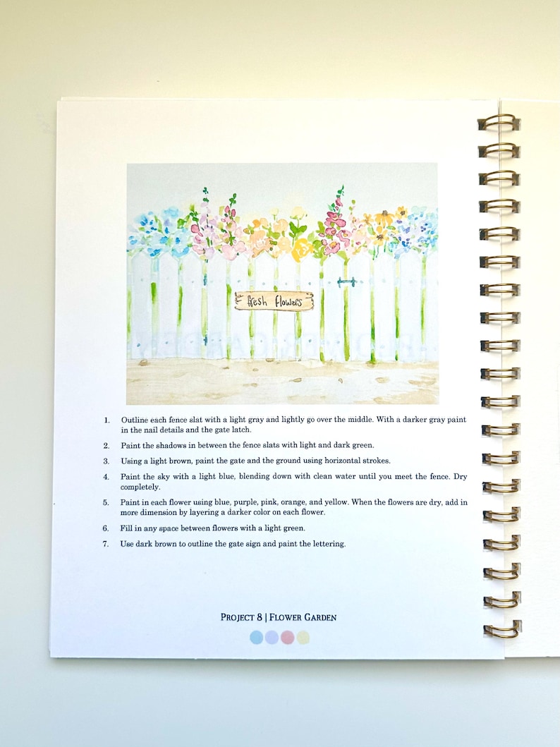 May include: A watercolor painting of a white picket fence with a sign that reads "Fresh Flowers". The fence is decorated with colorful flowers in shades of blue, purple, pink, orange, and yellow. The painting is a step-by-step guide for creating a flower garden.