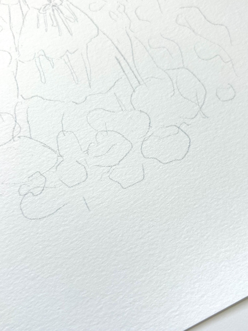 May include: A pencil sketch of a floral design with multiple flowers and leaves. The sketch is drawn on white paper.