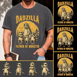 May include: Dark grey t-shirt with the text "DADZILLA" in yellow, featuring a cartoon dinosaur family wearing sunglasses. The shirt includes the names "Jackson", "Jensen", "Ava", and "Elliana", with "FATHER OF MONSTER" below.