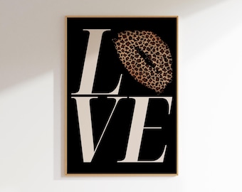 May include: A black and white print with the word "LOVE" in a bold, sans-serif font. The "O" is replaced with a leopard print lip.