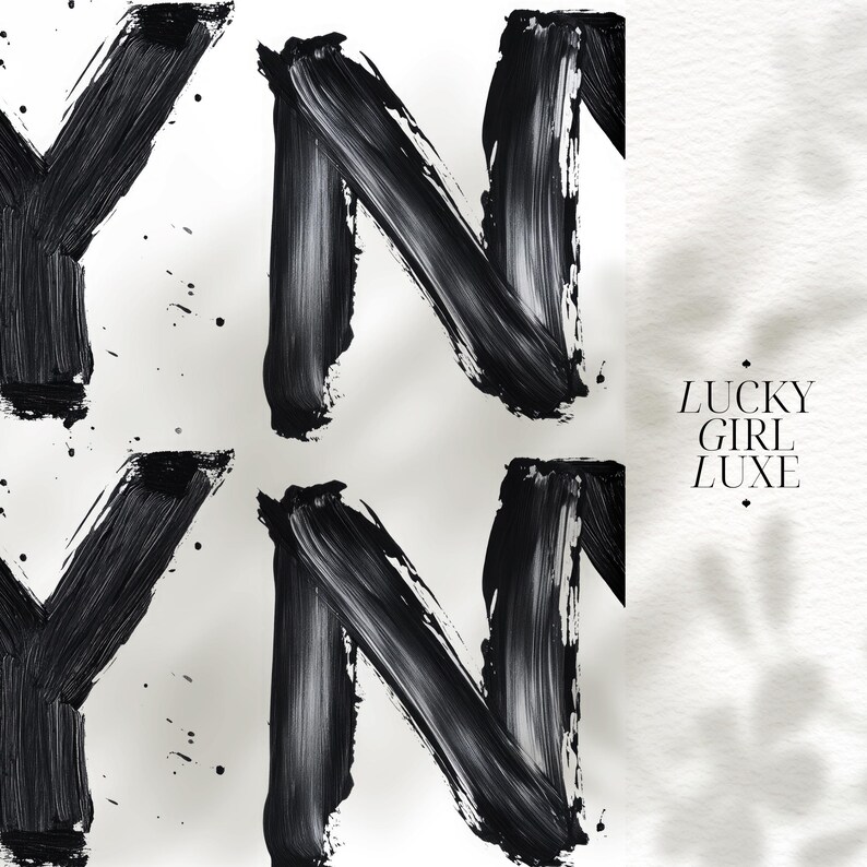 May include: Black and white abstract print featuring bold, brushstroke-style letters 'Y' and 'N' repeating in a pattern. The text 'LUCKY GIRL LUXE' is visible on a textured off-white background.