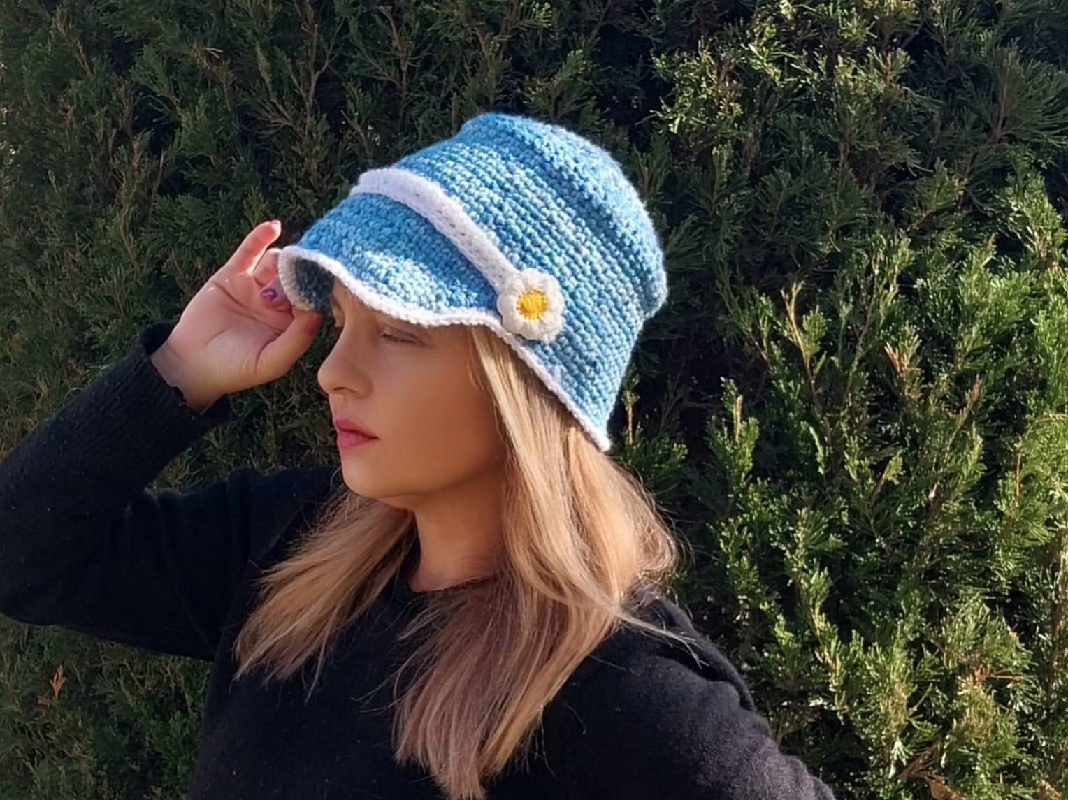 Hand-crocheted Blue Bucket Hat With White Flower Detail  display picture 1