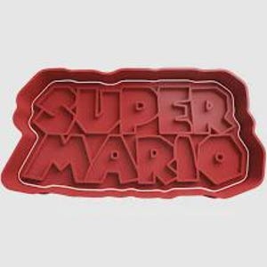 May include: Red plastic cookie cutter in the shape of the words "SUPER MARIO". The letters are raised and the cutter has a rectangular outline. The cutter is designed for making biscuits or other treats.