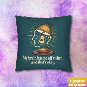 May include: Teal square throw pillow with a graphic of a lamp inside a head silhouette, with the word "ON" on the lightbulb. The text reads "My brain has no off switch. And that's okay."