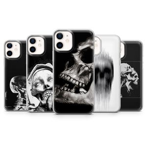 May include: A collection of black and white phone cases featuring various skull designs. The cases showcase detailed illustrations of skulls, skeletons, and abstract art, offering a gothic and edgy aesthetic.