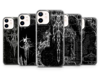 May include: A collection of five black phone cases with white abstract designs. Each case features a different intricate pattern, with a clear protective border. The designs include gothic-inspired illustrations and handwritten text.