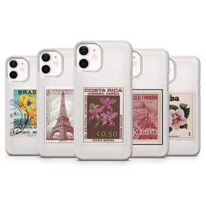 May include: Five white phone cases with vintage postage stamp designs. The stamps feature images of flowers, the Eiffel Tower, and other graphics. The Costa Rica stamp shows purple orchids and the text "CORREO AEREO".