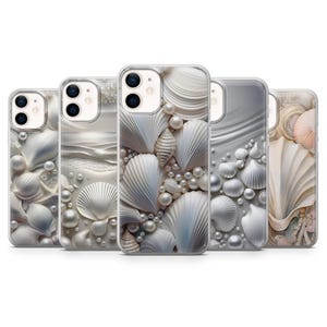 May include: Five phone cases with a seashell design. The cases feature white seashells, pearls, and a pearlescent background. The cases are in a row, showcasing the different designs and textures.