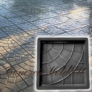 May include: A black rubber mold for making concrete patio stones. The mold is square and features a design of concentric circles.