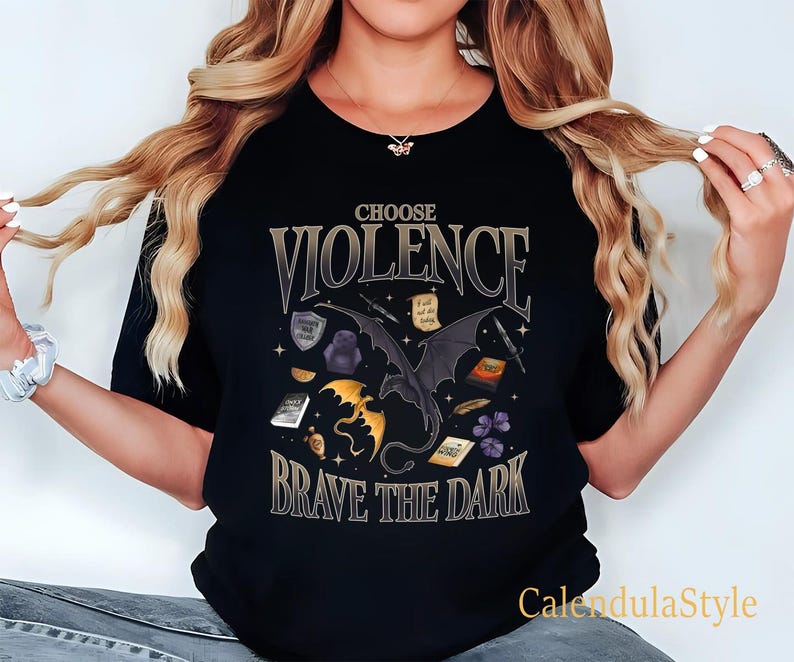 May include: Black t-shirt with a graphic print of a dragon and the text "Choose Violence Brave the Dark".