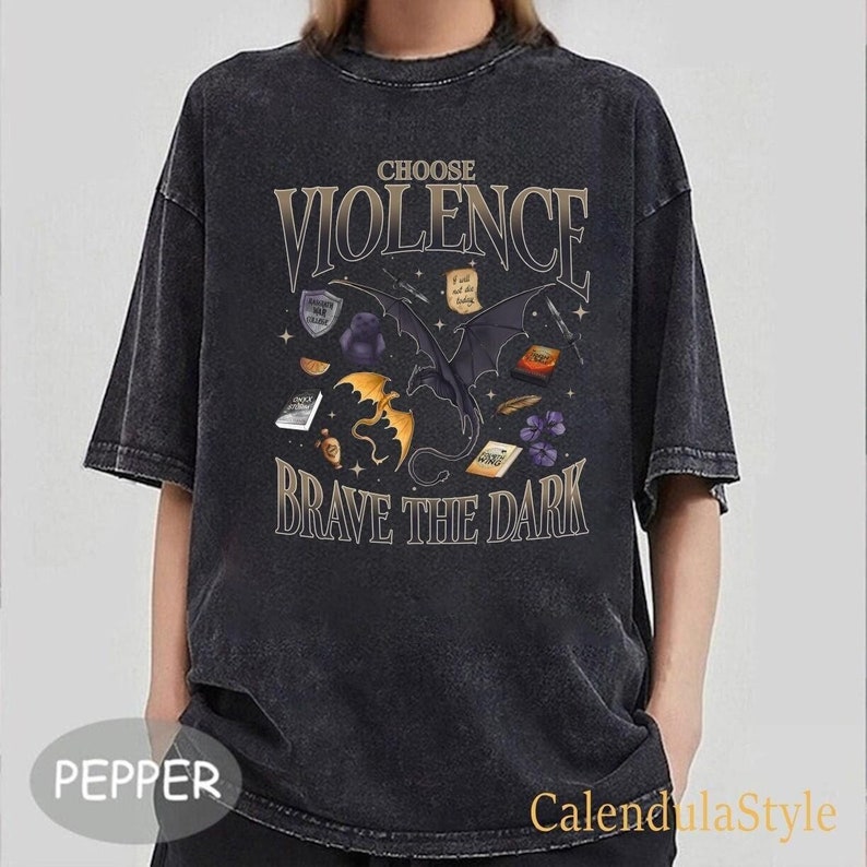 May include: Black t-shirt with a graphic design featuring a black dragon with gold accents and the text "Choose Violence Brave the Dark".