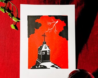 May include: A black and white linocut print of a church on a hill with a lightning bolt in the sky. The sky is red and the clouds are black.