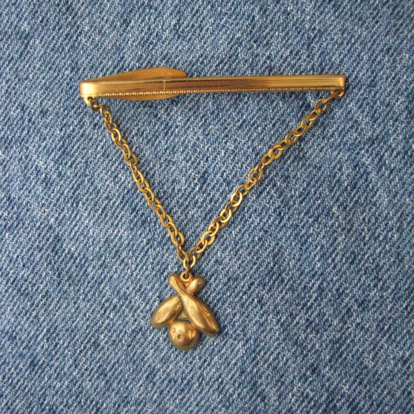 Gleaming gold tone vintage Hickok USA tie clip with bowling pins & ball