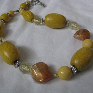 Vintage chunky yellow wood bead necklace with clear crystal bead accents
