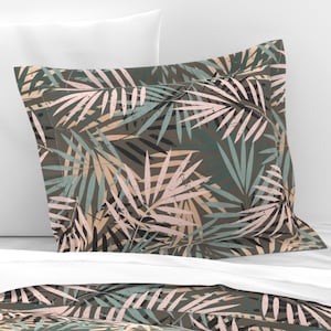 May include: A pillowcase with a tropical leaf pattern in shades of green, brown, and pink. The leaves are stylized and have a distressed look.
