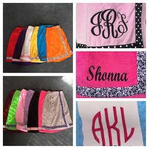 May include: Assortment of colorful towels with embroidered names and initials. The towels are made of soft, absorbent material and are perfect for wrapping up after a shower or bath.