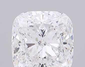 May include: A close-up of a cushion-cut diamond. The diamond is clear and colorless, with numerous facets that reflect light. The shape is square with rounded corners, and the overall appearance is brilliant and sparkling.