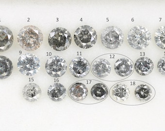 May include: A collection of 18 round, gray diamonds, numbered 1 through 18. The diamonds are arranged in rows, with the first row containing diamonds 1 through 7, the second row containing diamonds 8 through 14, and the third row containing diamonds 15 through 18.