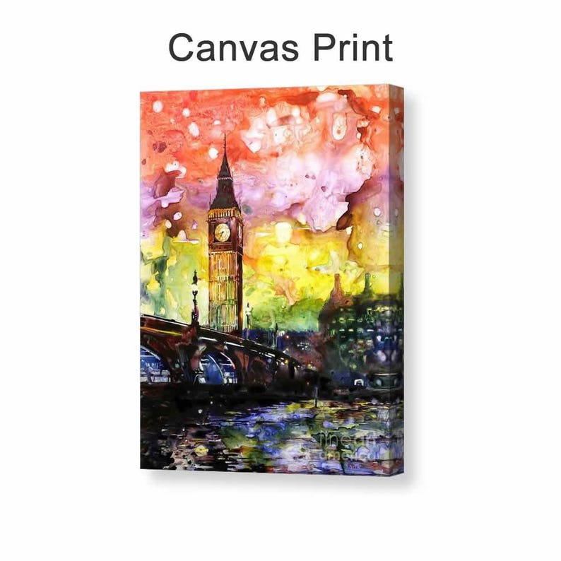 Puede incluir: Impresi&oacute;n en lienzo de una pintura de acuarela que representa el ic&oacute;nico Big Ben y un puente en Londres. La obra de arte presenta colores vibrantes, incluyendo tonos naranja, amarillo y p&uacute;rpura en el cielo, con reflejos en el agua. El texto "Canvas Print" est&aacute; arriba.