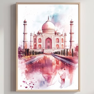 May include: Watercolor painting of the Taj Mahal in India, framed in a light wood. The artwork features the iconic white marble mausoleum with pink and red hues, reflected in a body of water. The sky has soft blue and pink watercolor washes.