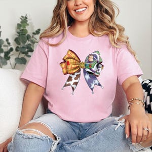 May include: A trio of ceramic storage canisters with lids, adorned with a geometric design in blue, white, and grey. The canisters are of varying sizes, ideal for kitchen use.