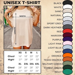 May include: A unisex t-shirt in a neutral color, with a size chart showing chest and height measurements in inches. Available colours include black, white, and navy. The shirt is shown on a person.