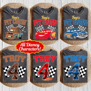 May include: Six gray t-shirts with various Disney Cars graphics. Designs include "Troy's Pit Crew" with Mater, Lightning McQueen, and Doc Hudson. Other shirts say "Troy 4" with race car themes. The text "All Disney Characters!" is also visible.