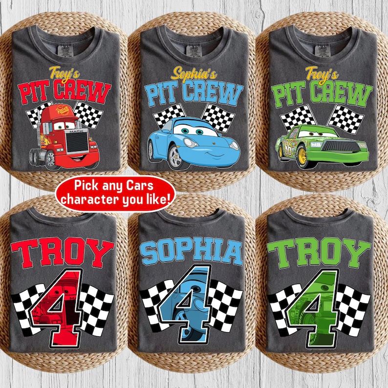 May include: Six gray t-shirts with racing-themed designs. Three shirts feature the text "Pit Crew" with different car graphics and names. The other three shirts display names and the number "4" with checkered flags. The text "Pick any Cars character you like!" is also present.