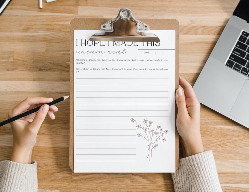 May include: A printable worksheet on a clipboard with the text "I hope I made this dream real."  The worksheet has lines for writing and a small floral illustration.