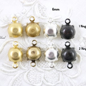 Puede incluir: Seis cierres redondos de metal de 6 mm con un solo bucle o dos bucles. Los cierres est&aacute;n disponibles en oro, lat&oacute;n antiguo, plata y negro.