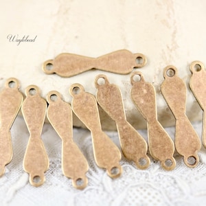 Antique Brass Small 4x16mm Solid Bow Shape 2-Hole Connectors - 10