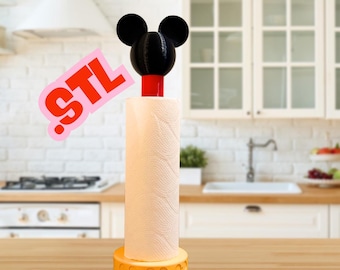 May include: A yellow paper towel holder with a Mickey Mouse head on top. The holder is on a wooden countertop in a kitchen.