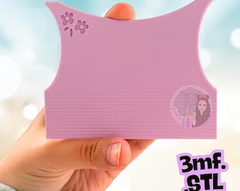 May include: A light purple, rectangular, 3D-printed plastic tool with a concave top edge and a small embossed flower design in the upper left corner. The surface features horizontal lines and a circular logo depicting an elephant and a person.