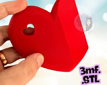 May include: A bright red, three-dimensional heart-shaped object with a smooth, matte finish. The object features a small, cut-out heart shape on its upper left side and includes the text 3mf. STL printed in black on a light purple background.