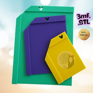 May include: Three flat, rectangular plastic tools in green, purple, and yellow, each featuring a small mouse-ear-shaped cutout at the top. The yellow tool displays a circular graphic of a person with an elephant. Text reads 3mf. STL and DIGITAL DOWNLOAD.