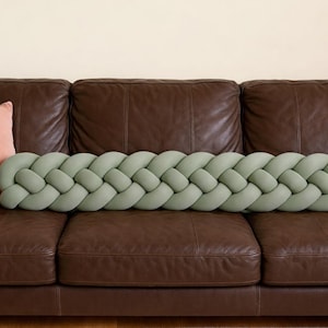 May include: A set of three ceramic mugs with a speckled, matte finish in cream, light grey, and dark grey. Each mug has a simple, minimalist design, suitable for coffee or tea.