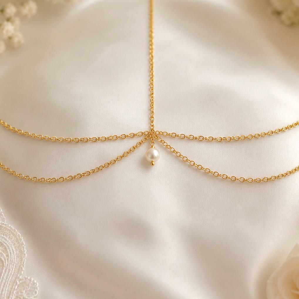 Delicate pearl bridal head chain in gold-tone stainless steel for wedding hairstyles and special occasions